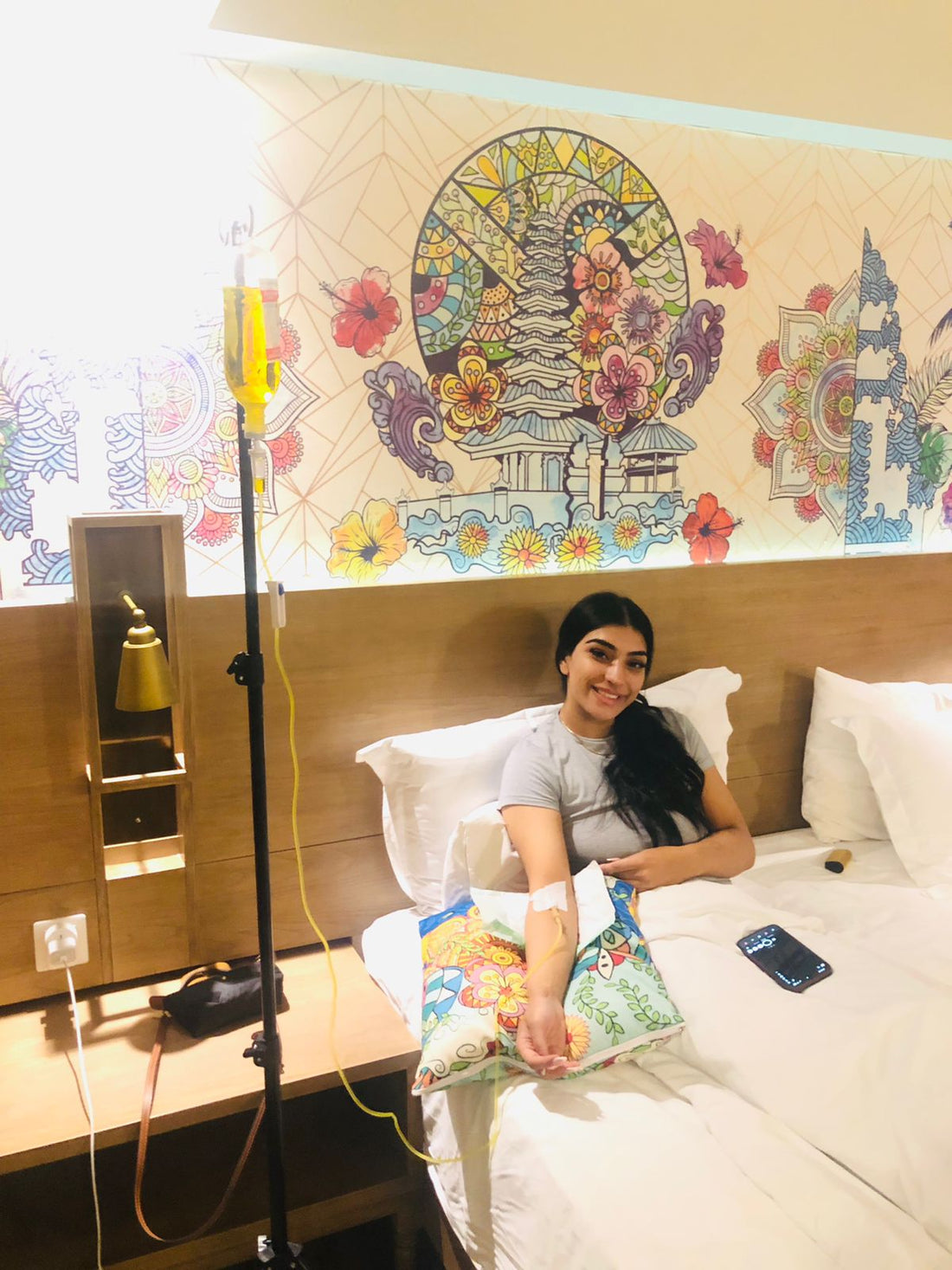 Patient receiving IV drip therapy at hotel in Bali - Ever Well Health